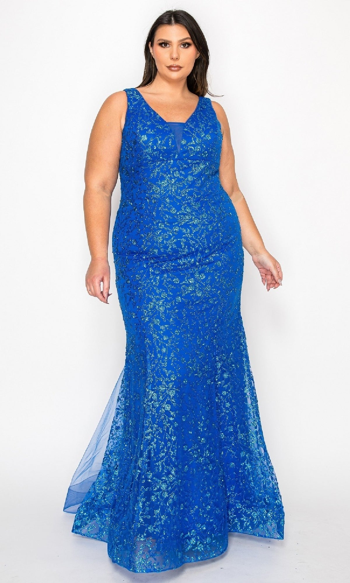 A woman models the Plus-Size Long Glitter Mermaid Prom Dress W1136, a sleeveless royal blue gown with sparkling glitter details and a floor-length mermaid silhouette, against a plain white background.